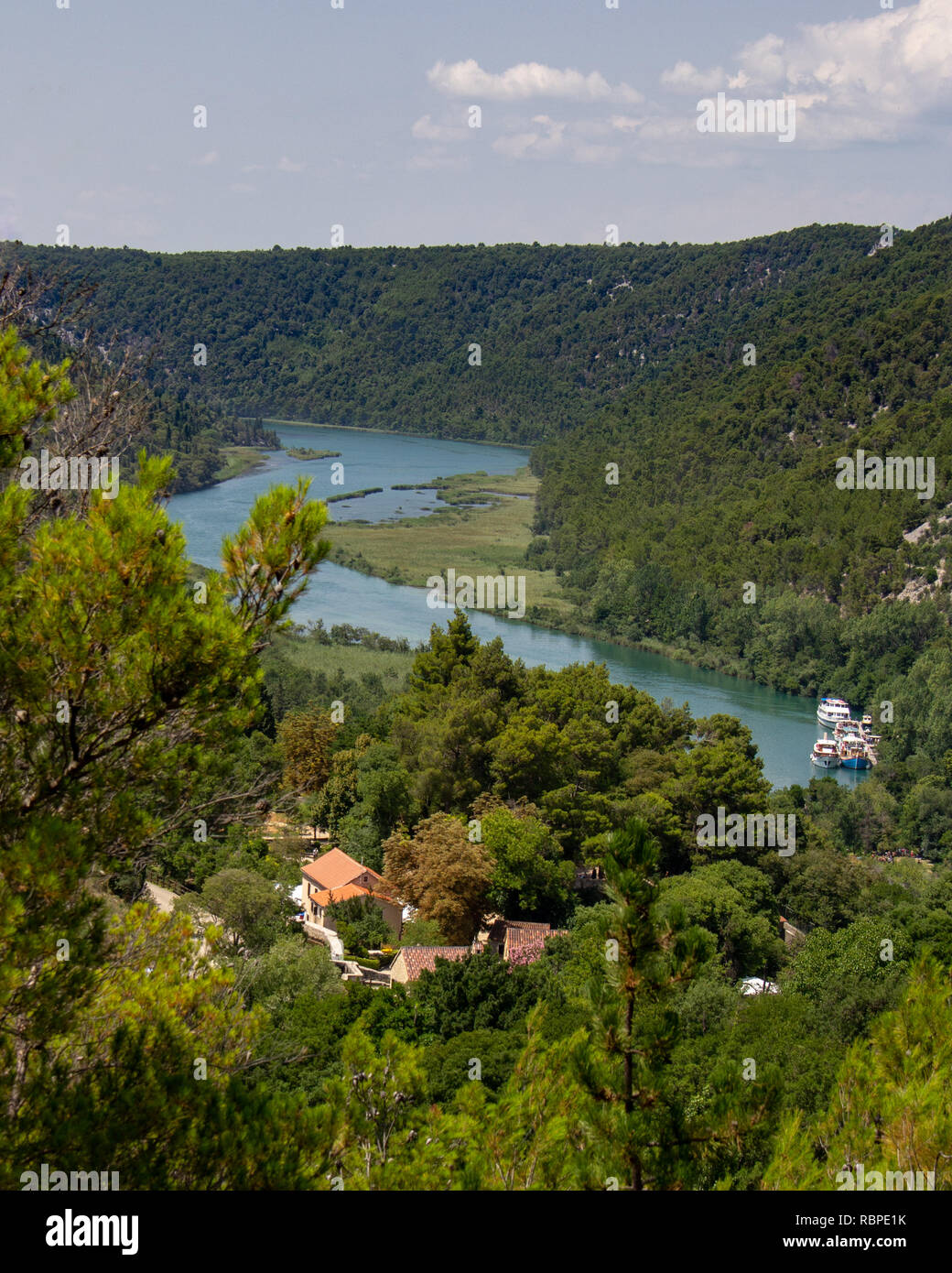 Boats are docked on the Krka River in the Krka National Park in Croatia Stock Photo