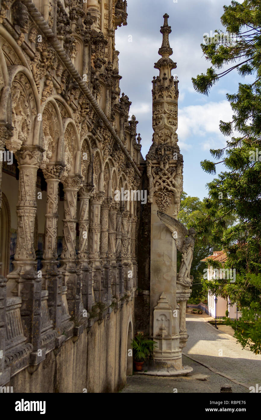 Ornately carved columns decorate the exterior of the Bussaco Palace Hotel in Portugal Stock Photo