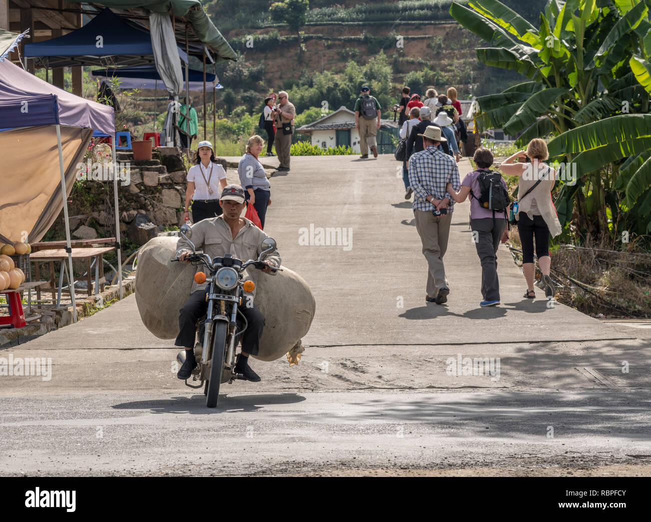 Motorcycle carrying picked tea leaves at Huaan Unesco World Heritage site Stock Photo