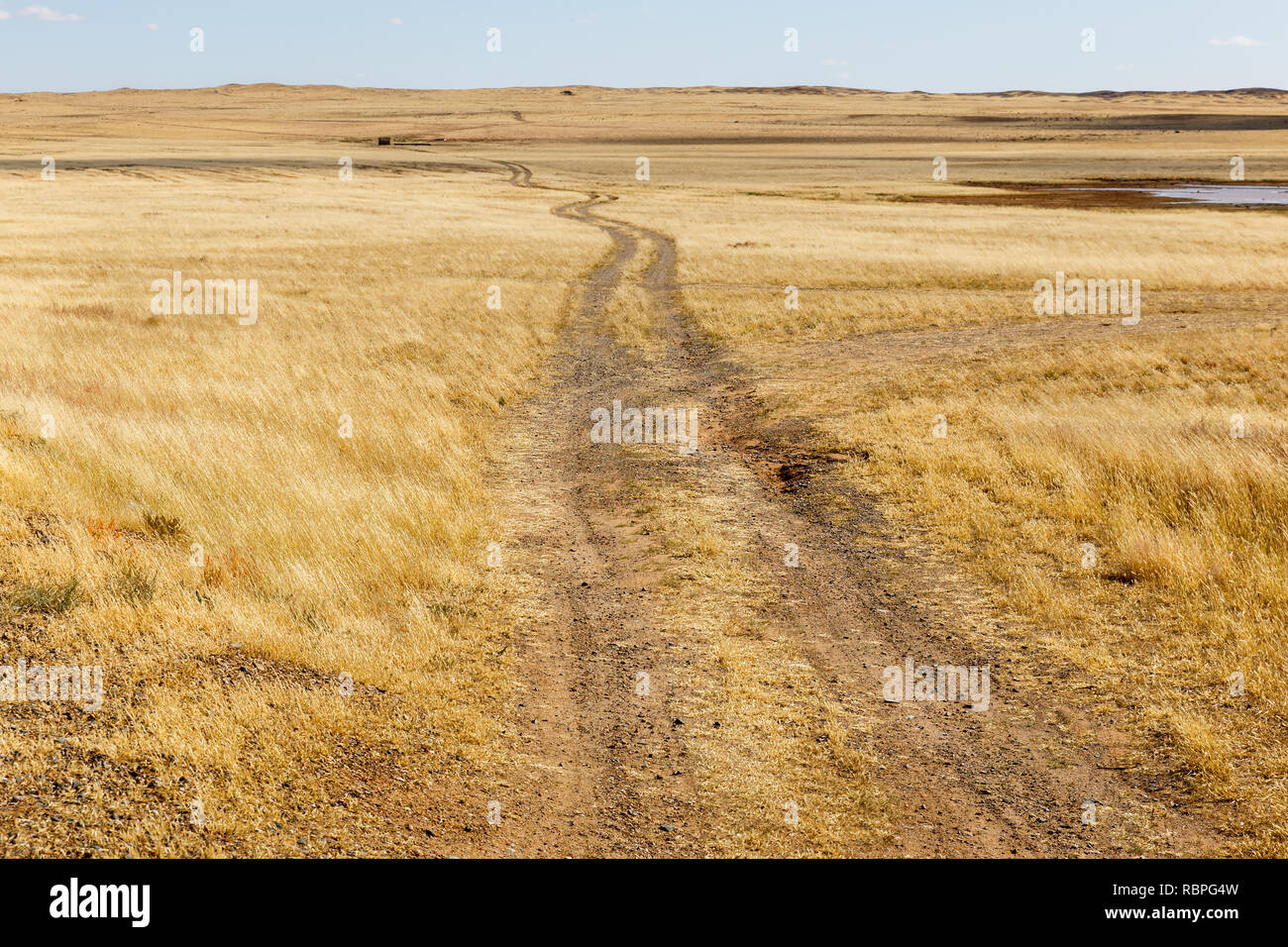 rural road in the steppe, desert Gobi Stock Photo