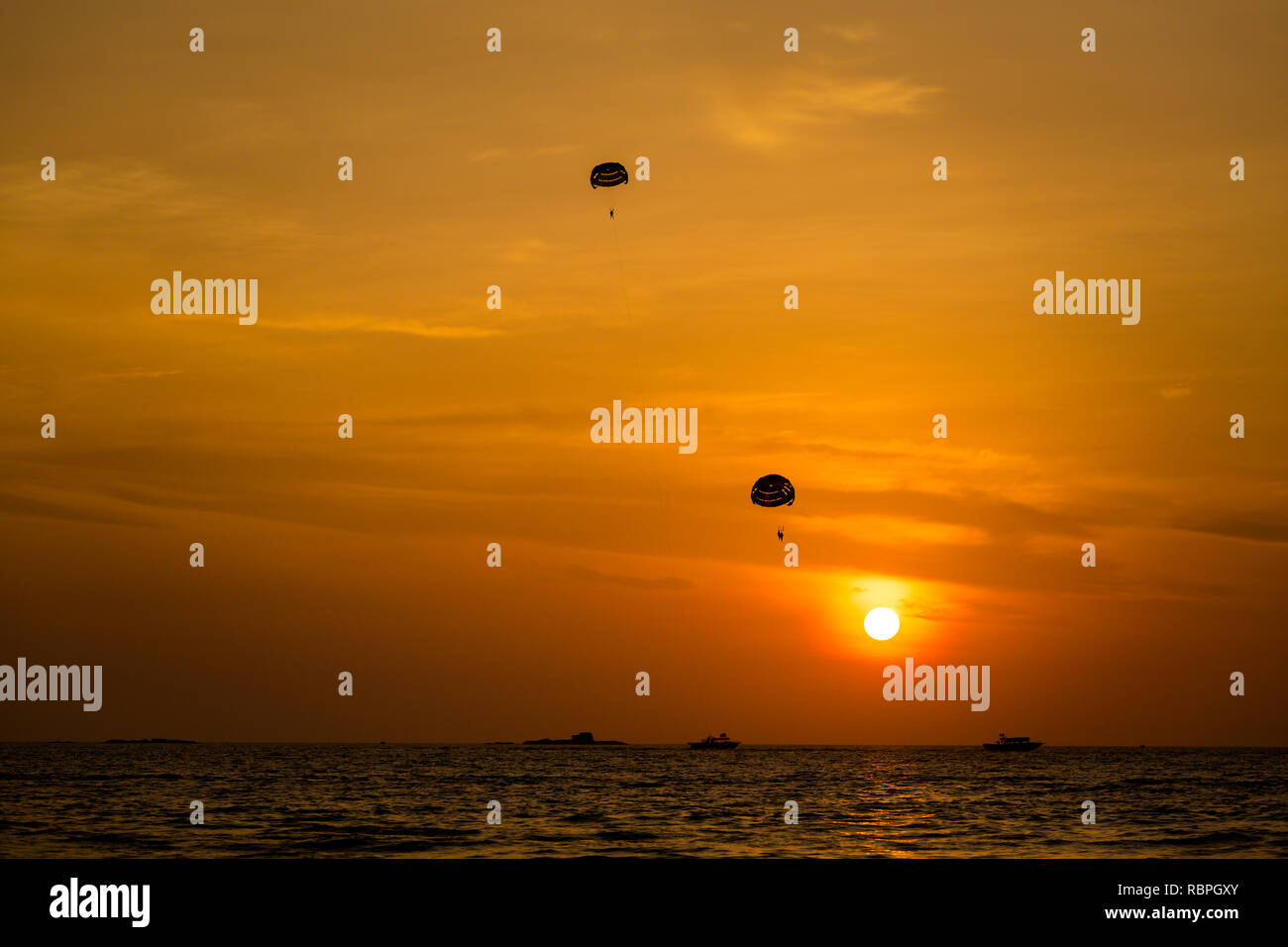 Watersport parachute on Pantai Cenang beach on tropical Langkawi island in Malaysia. Beautiful