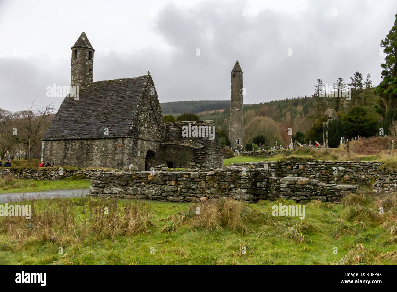 Saint Kevin's Kitchen and the Round Tower at the Glendalough Monastic Site in Wicklow, Ireland Stock Photo