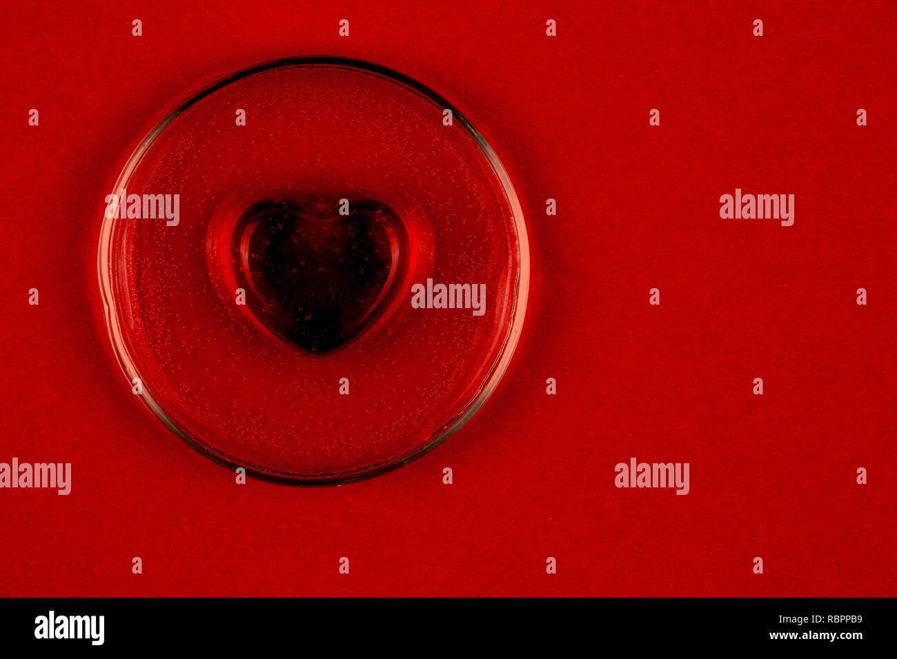 Abstract black heart on red background as a symbol of Valentine day ...