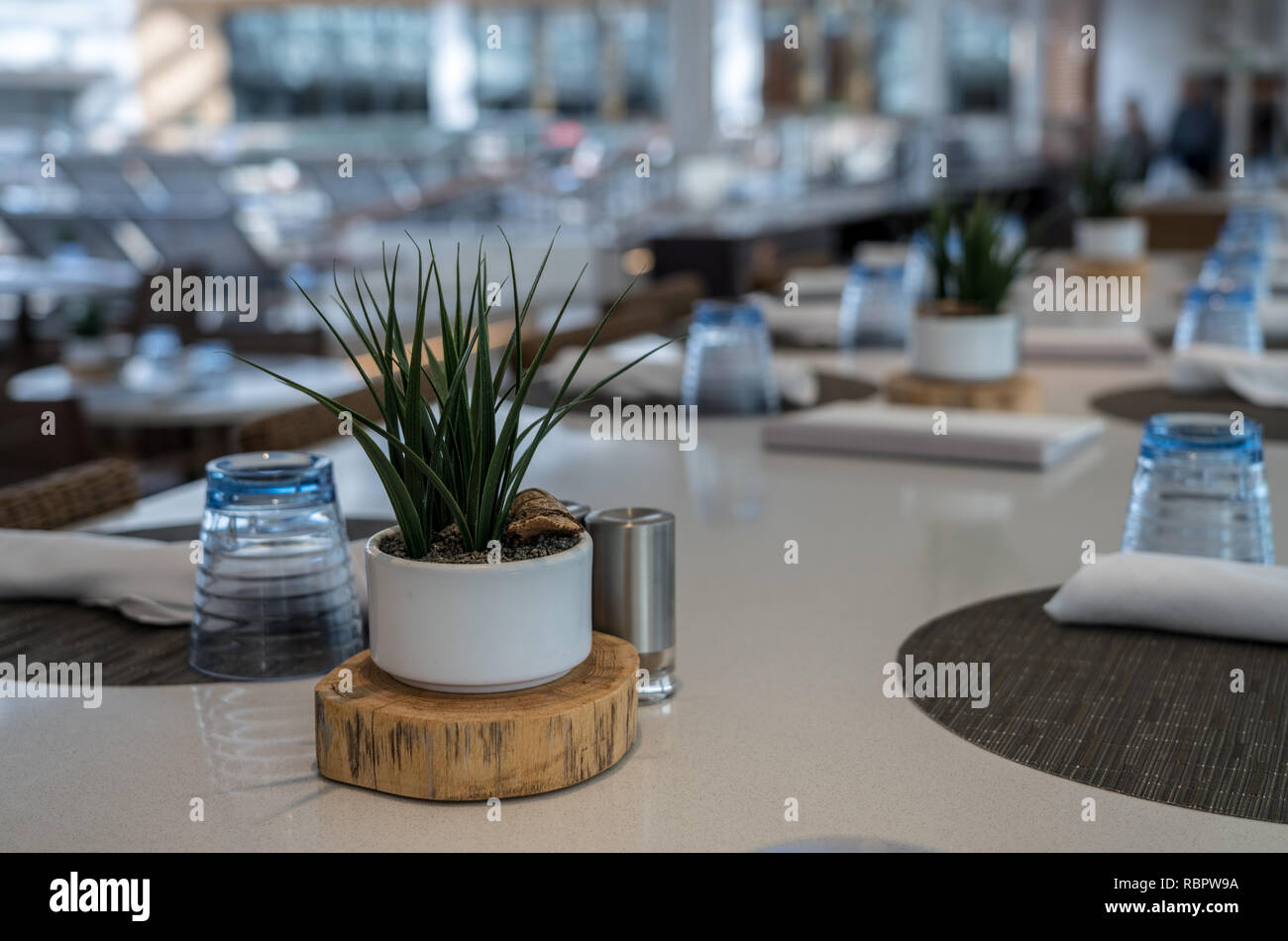 Large shared table in restaurant or cafe Stock Photo