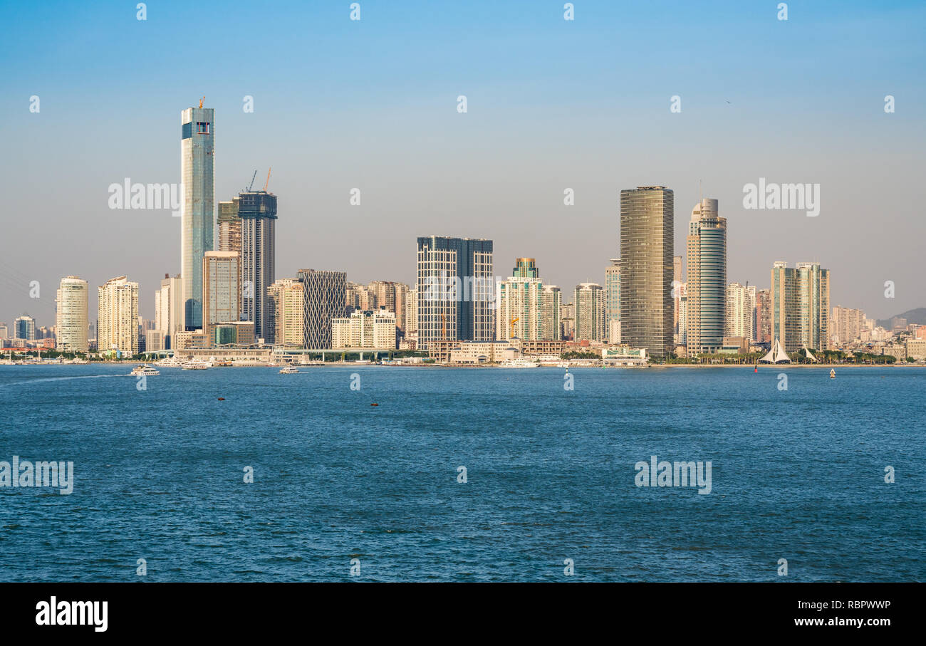 Skyline of the city of Xiamen from the sea approaching port Stock Photo