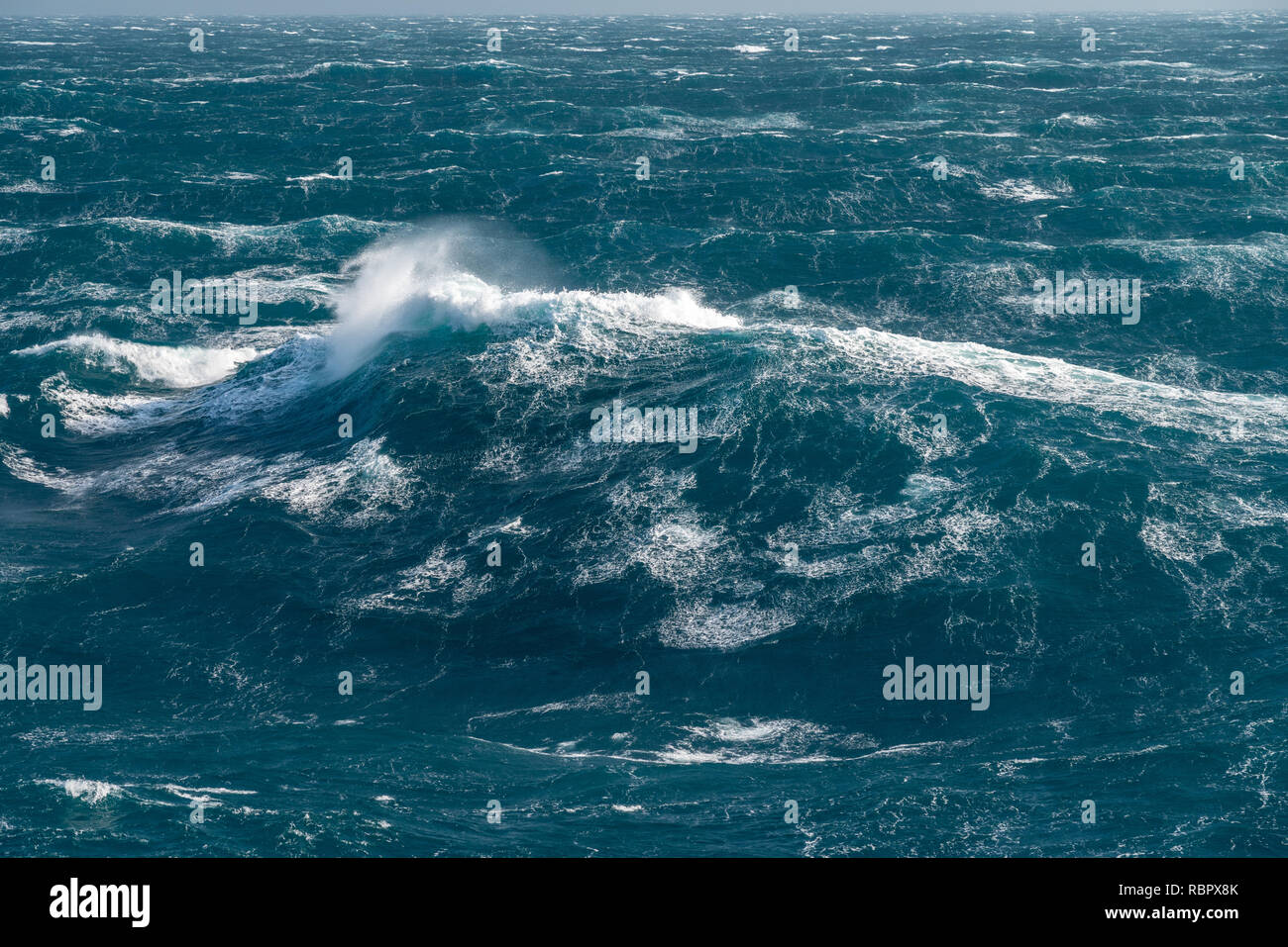 Modern cruise ship traveling through rough seas Stock Photo