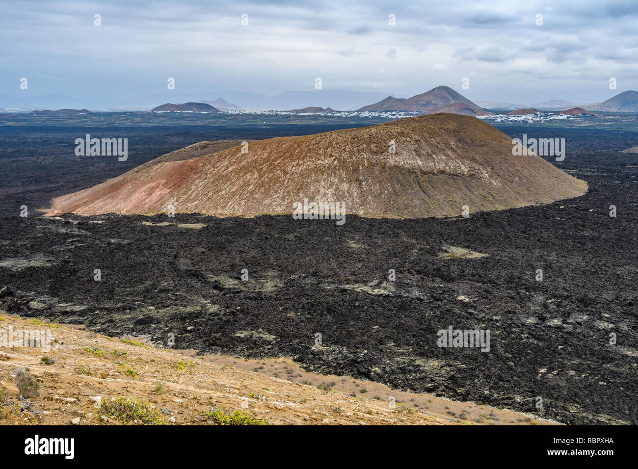 Volcanic cone  in the arid Timanfaya National Park, Lanzarote, Spain Stock Photo