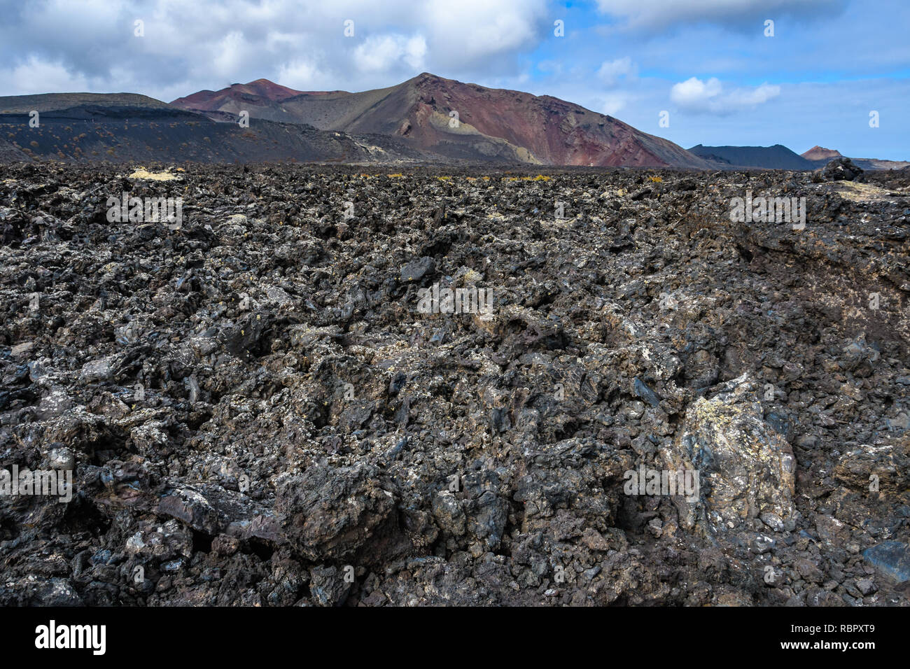Black lava in the volcanic Timanfaya National Park, Lanzarote, Spain Stock Photo