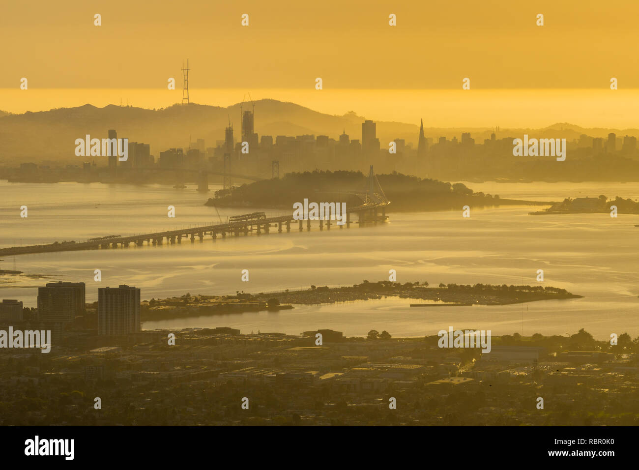 View towards San Francisco and the bay bridge at sunset, California Stock Photo