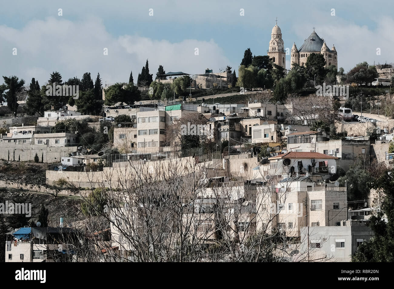 A westward view from the City of David depicts the Dormition Abbey on Mount Zion (top right). The City of David is an archaeological site and home of  Stock Photo