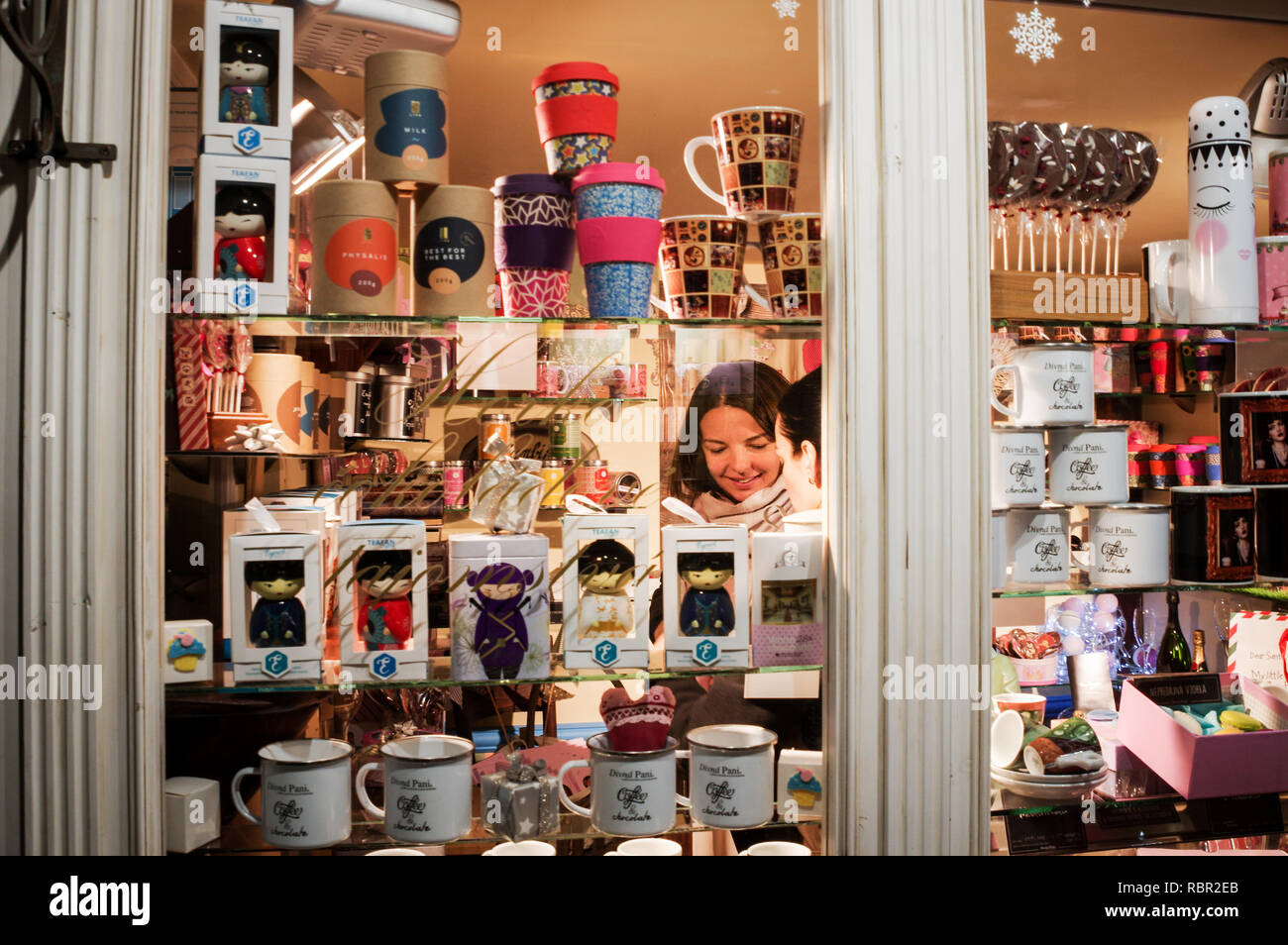 Two women shopping in a gift store seen through the shop window (Banska Stiavnica, Slovakia) Stock Photo