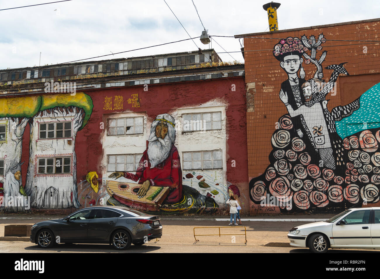 MINSK, BELARUS - AUGUST 12, 2019: Street Art On Oktyabrskaya Street.  Graffiti (mermaid, Cat, Giraffes, Roses, Kiss) On Wall Of Industrial  Building, Created As Part Of Vulica Brasil Festival (author Rogerio  Fernandes