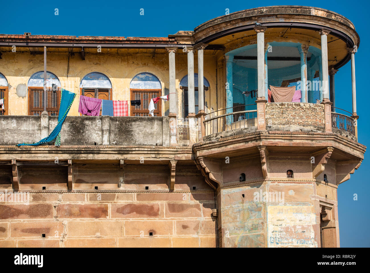 High level balcony detail of an old sandstone building in Varanasi facing the Ganges, India take on a sunny day Stock Photo