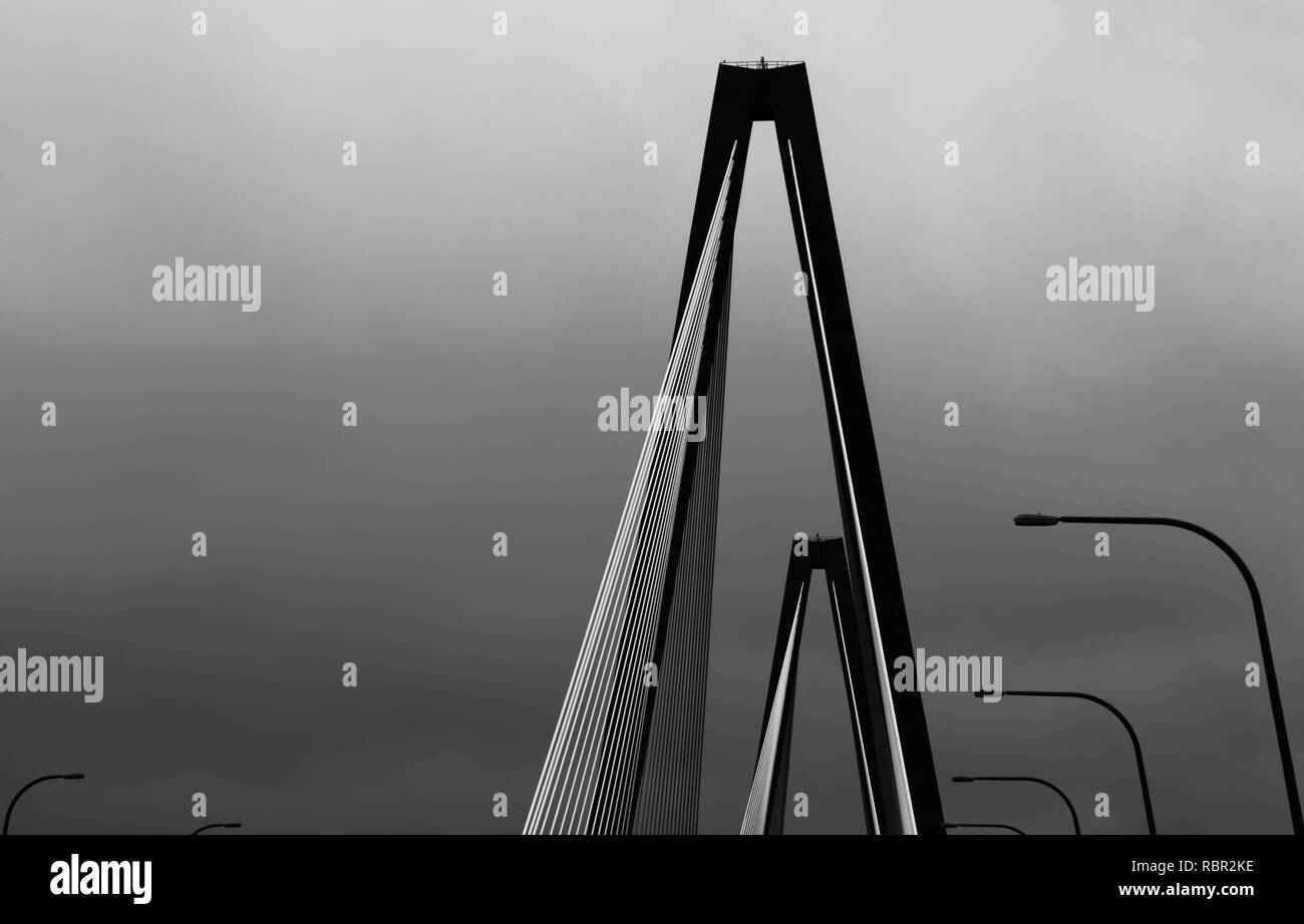 Background abstract in black and white of the top of a bridge with rows of street lights. Stock Photo