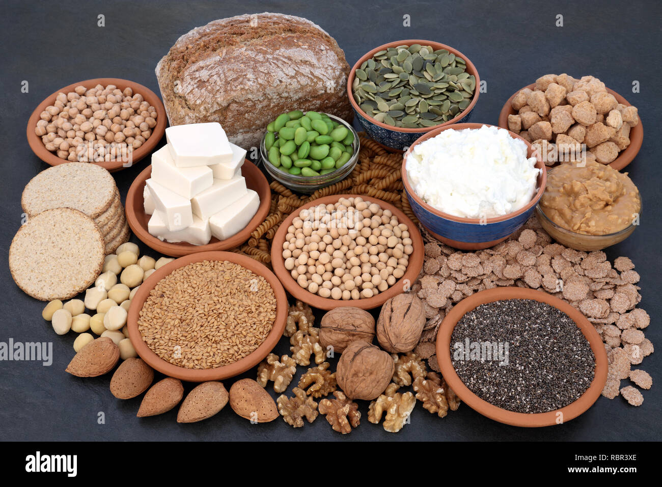 Super food for vegans with tofu bean curd, almond butter and yoghurt, legumes, sos mix, cereals