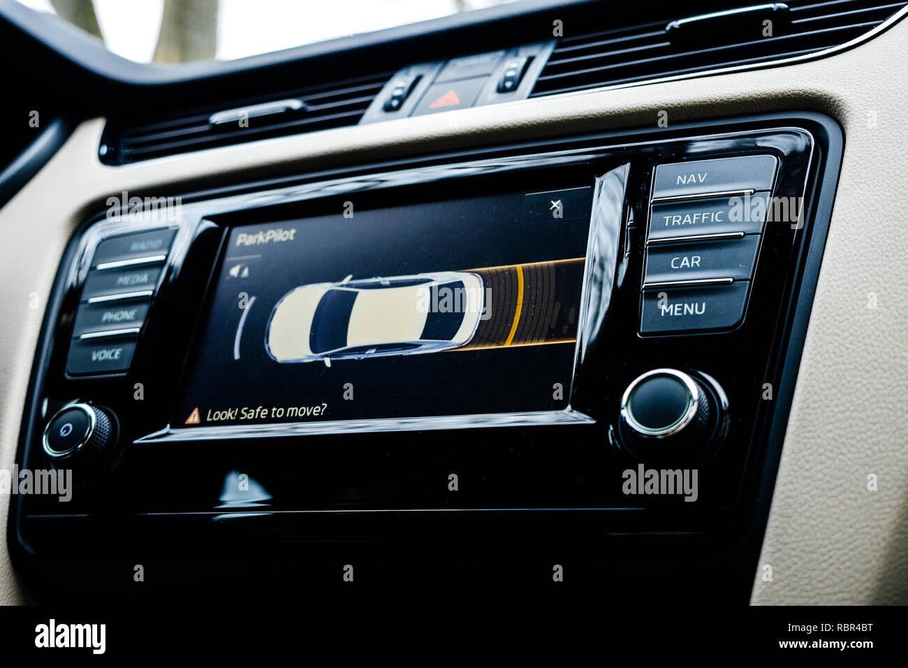 Car dashboard display showing next maneuver on the screen using the car