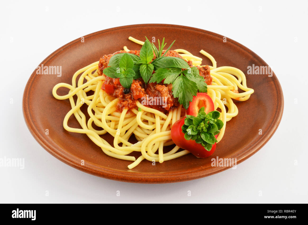Spaghetti Bolognese with fresh herb spices oregano, basil, rosemary