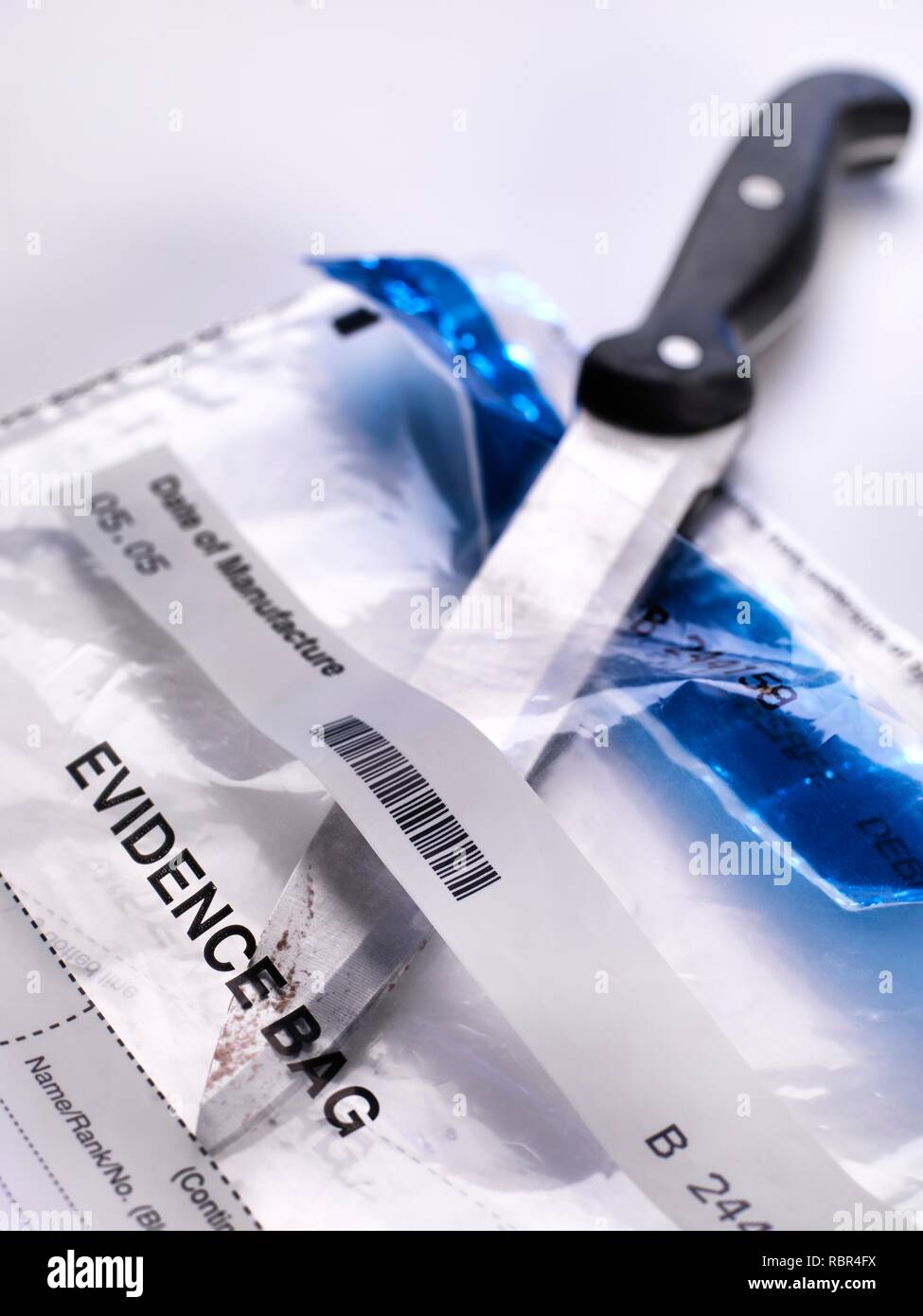 Forensic evidence collection. A knife about to be swabbed for DNA (deoxyribonucleic acid) and other forensic tests. Stock Photo