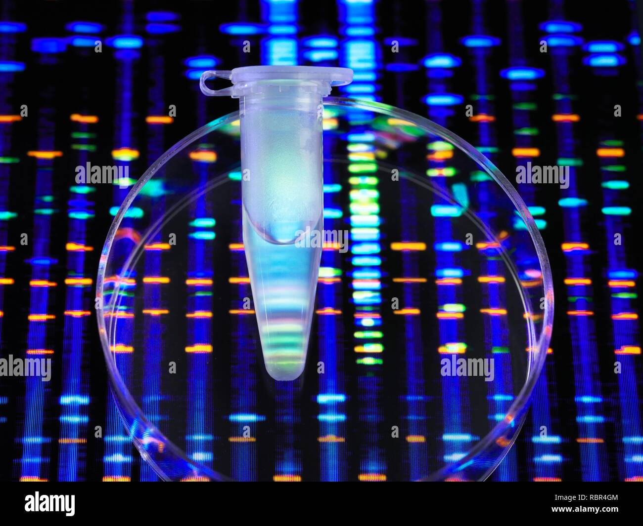 Genetic Research. A eppendorf tube containing a DNA (deoxyribonucleic acid) sample with the DNA profile in the background. Stock Photo