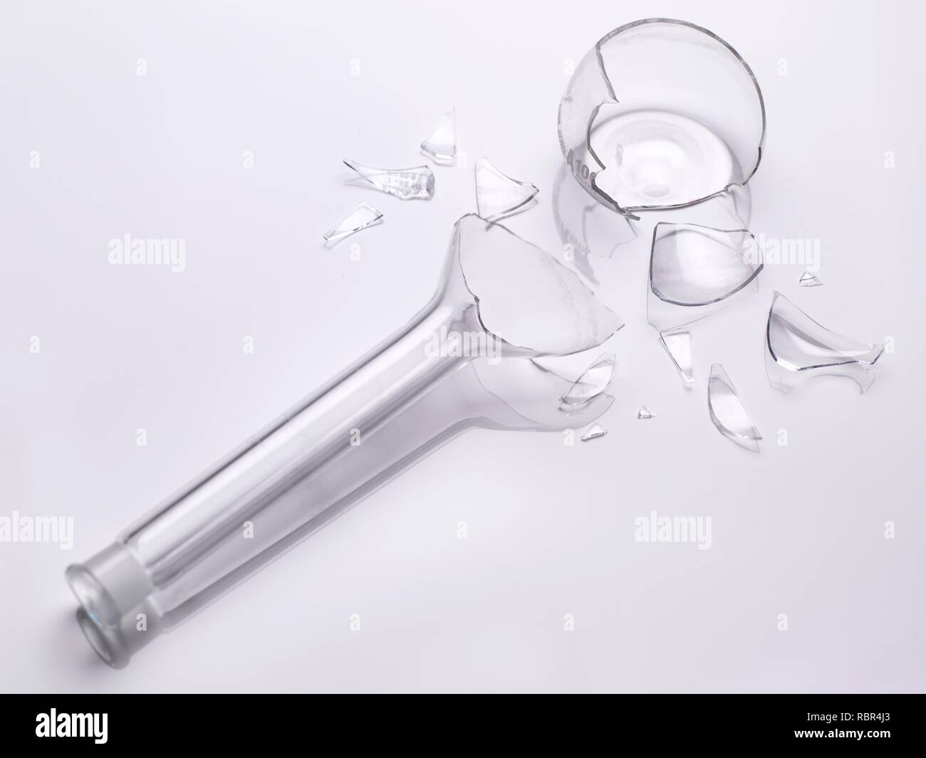 Accident during an experiment. Broken laboratory glassware flask. Stock Photo