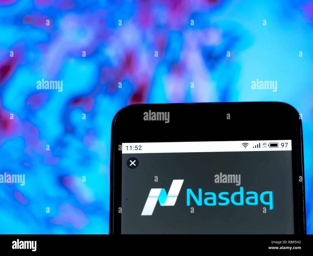 Nasdaq stock exchange logo seen displayed on smart phone stock photo