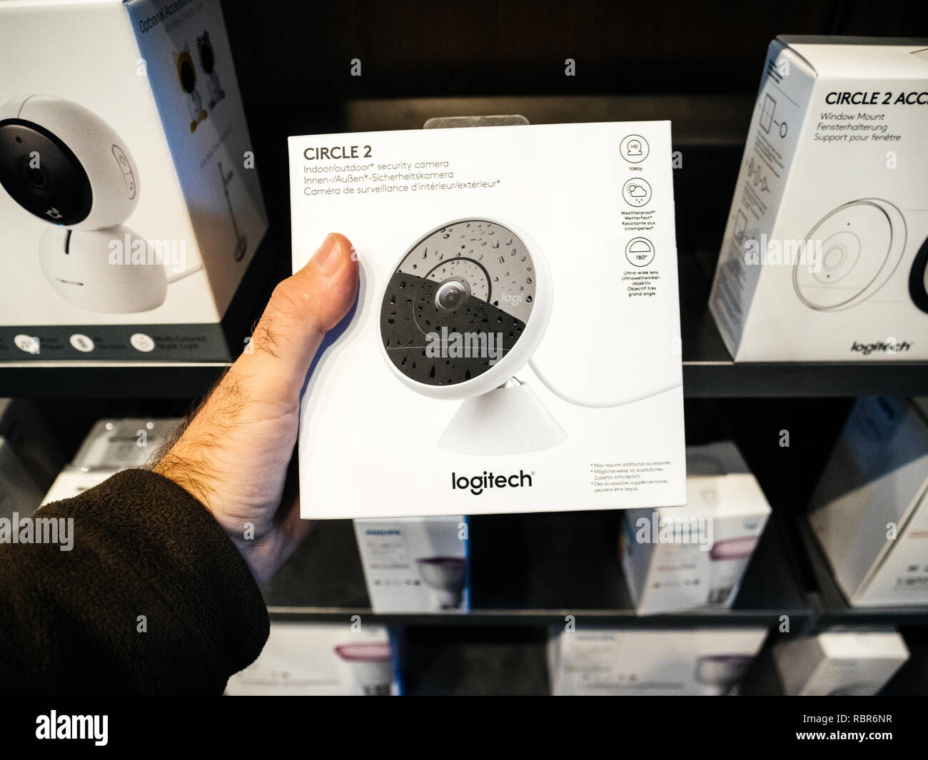 PARIS, FRANCE - OCT 25, 2018: Man holding in Apple Store the packaging of  new Logitech Circle 2 indoor-outdoor security camera - buy shopping  electronics Stock Photo - Alamy