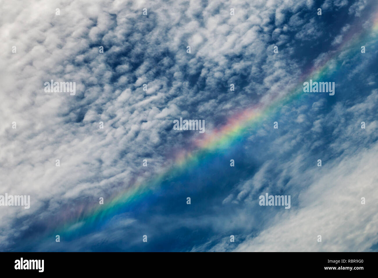 Rainbow and beautiful clouds in the sky Stock Photo - Alamy