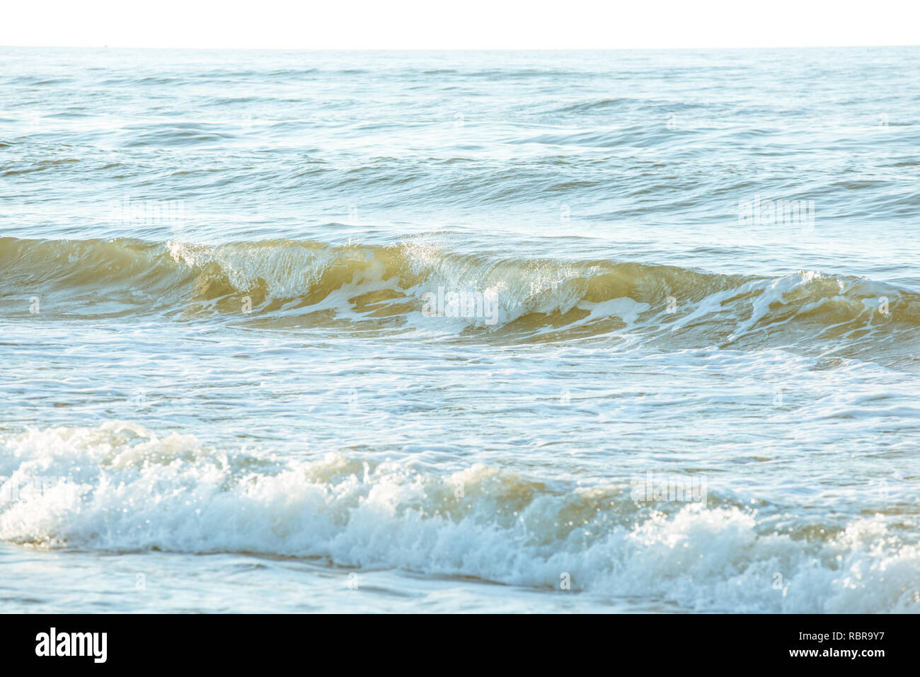 Ocean waves crashing  on the shore Stock Photo