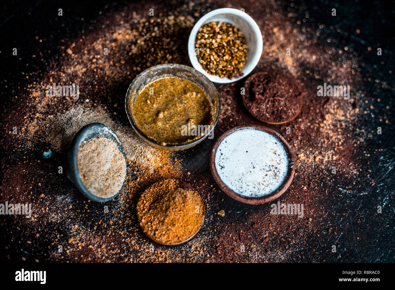 Close up of face pack of mung bean or green gram on wooden surface with sandalwood powder,milk,green gram powder,milk.This face pack is used in sap to Stock Photo