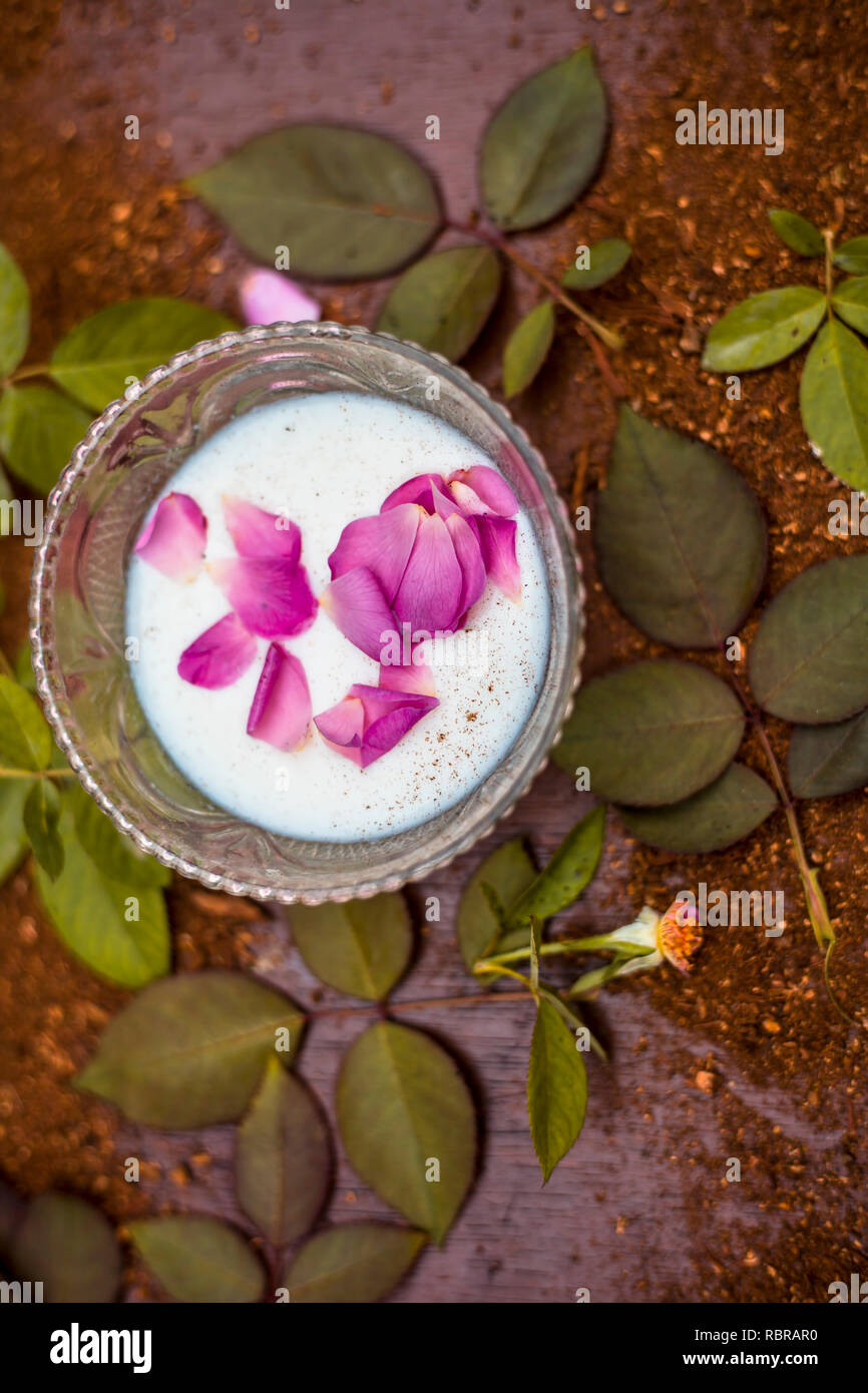 Close Up Of Home Remedy Of Scars Or Face Pack To Scars I E Sandal Wood Powder With Milk And Rose Water On Wooden Surface With Sandalwood Powder In Su Stock Photo