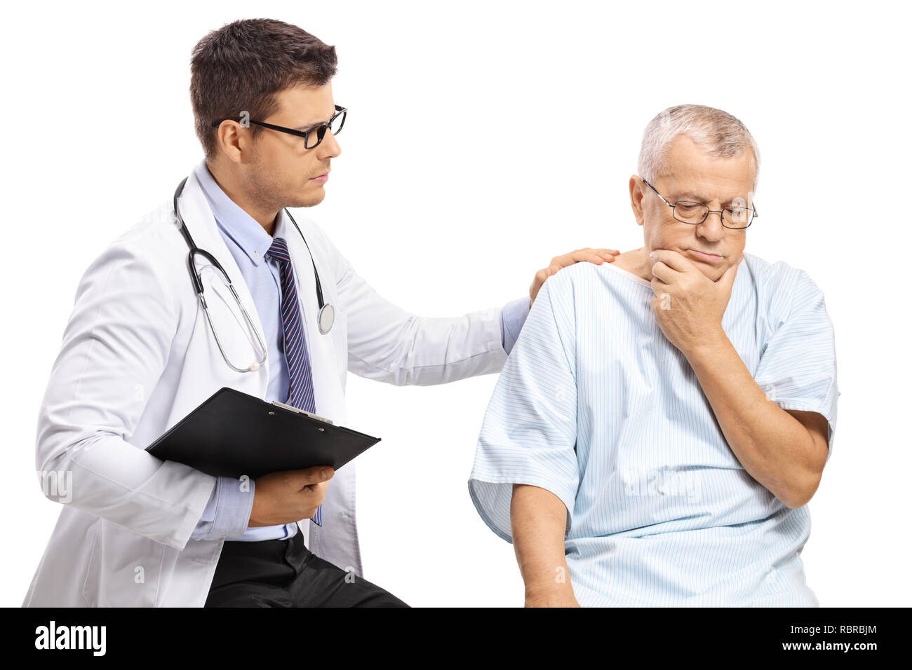 Male doctor with a worried elderly patient isolated on white background Stock Photo