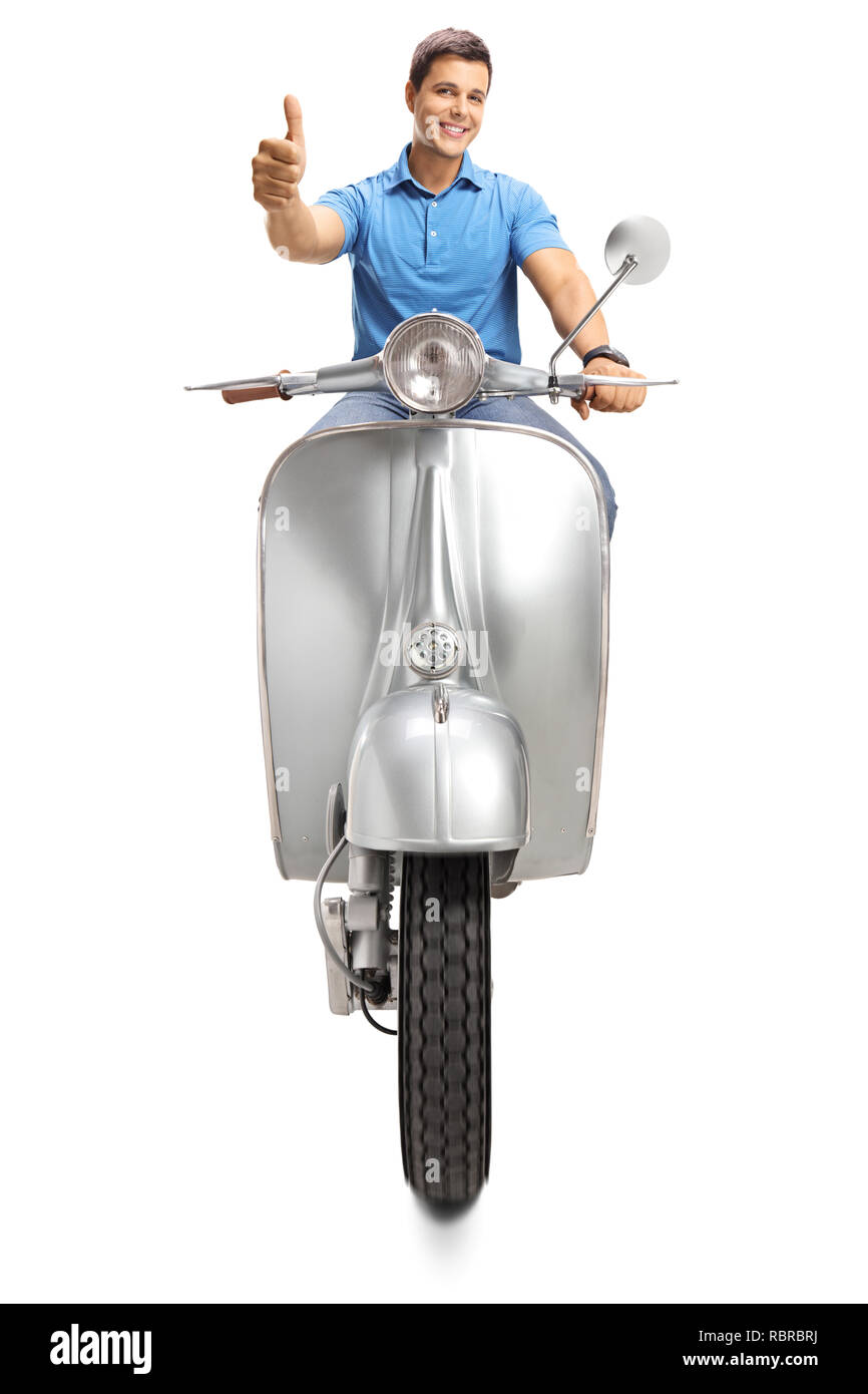Young man riding a vintage motorbike and giving thumbs up isolated on ...