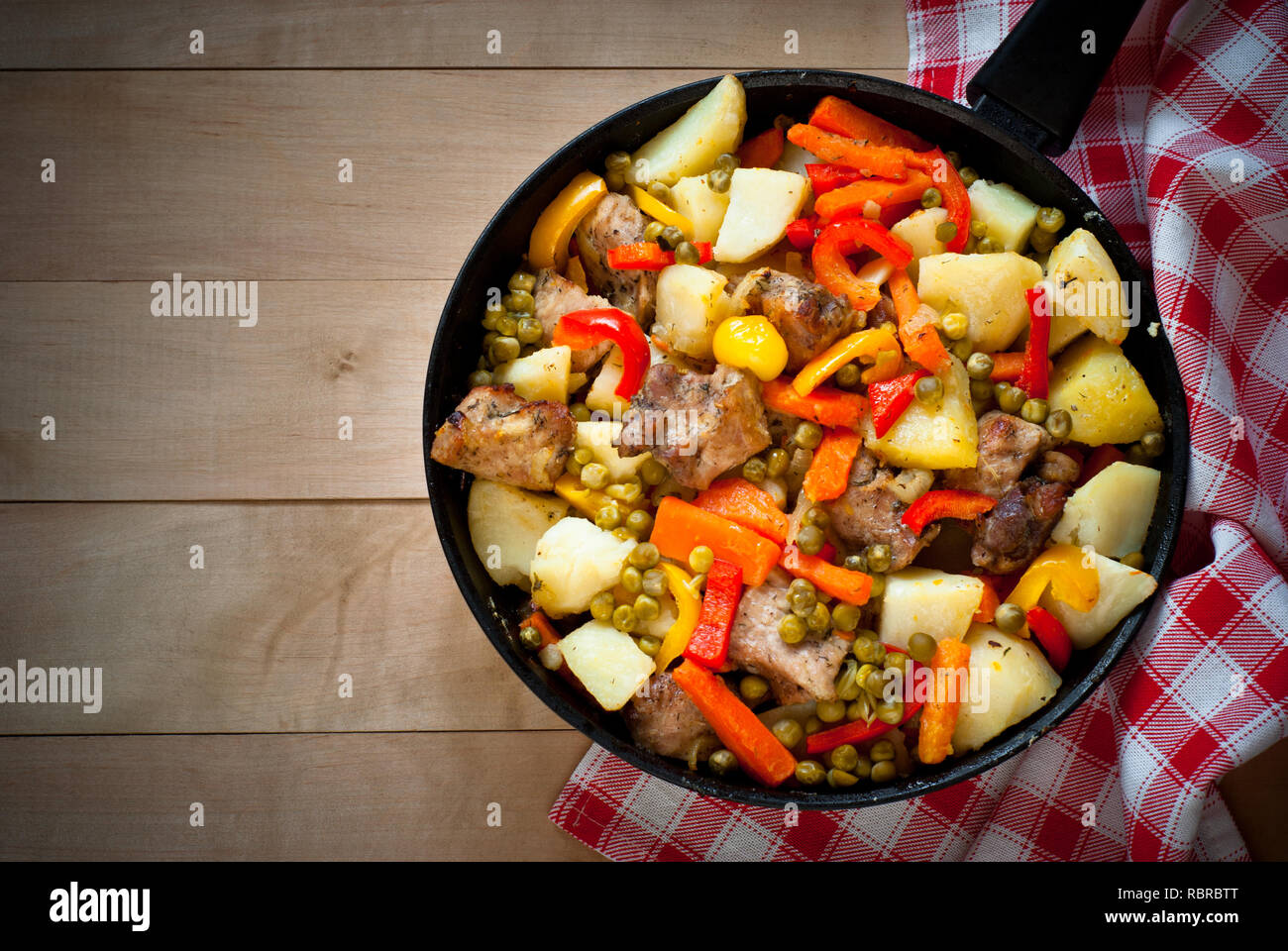 Meat with vegetables. Food in the frying pan. Main dish. Stock Photo
