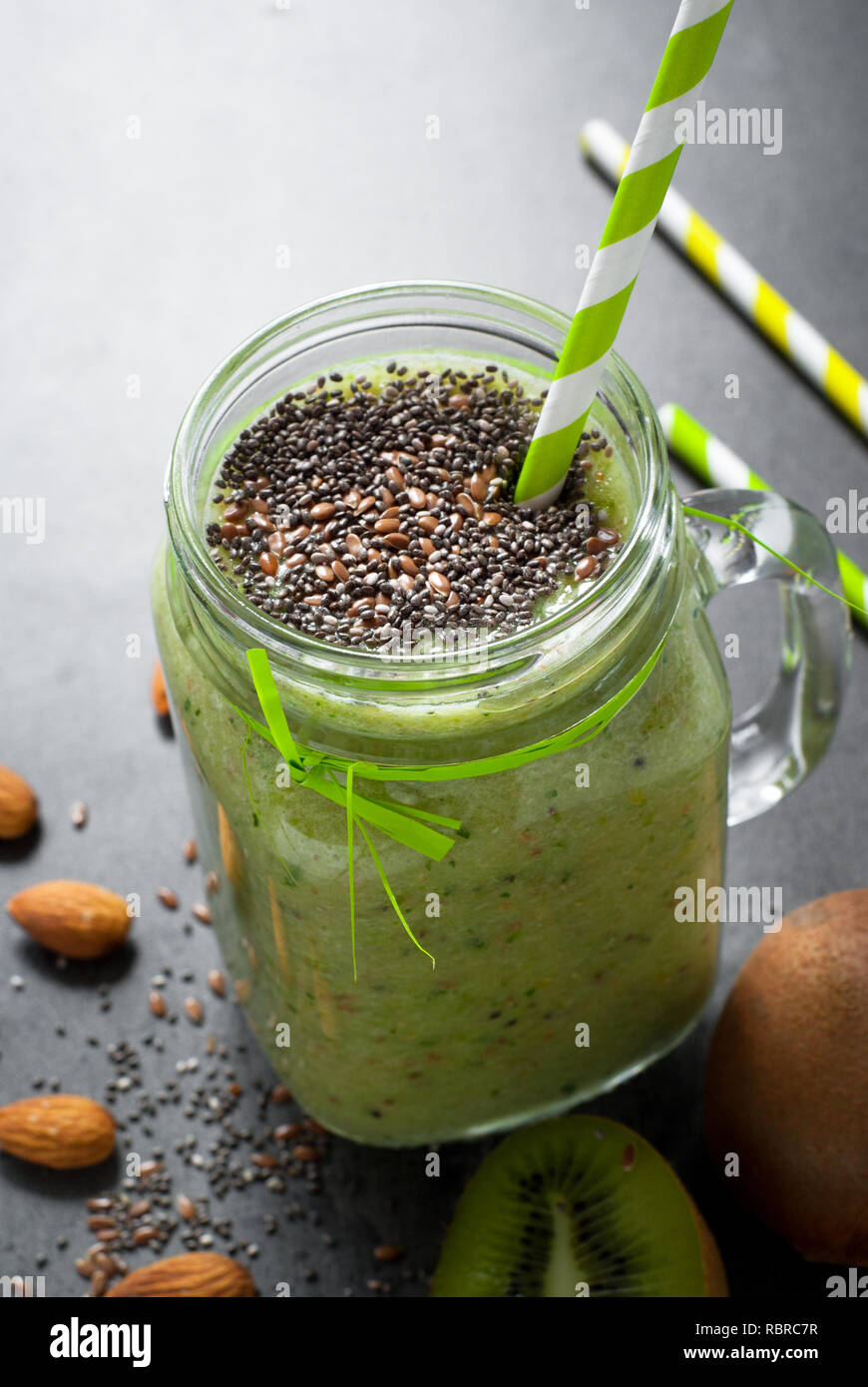 Green smoothie from fruit, leaves and seeds. A healthy eating and detox