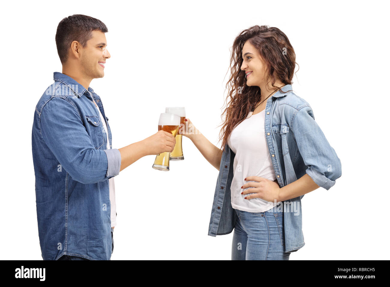 Making Cheers Young man and woman making cheers with glasses of beer isolated on ...