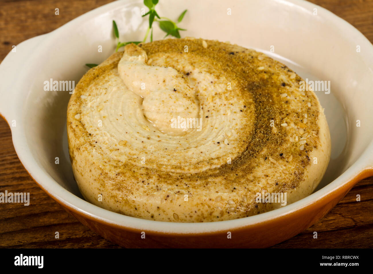 Vegetarian Humus with sesame seeds and thyme leaves Stock Photo Alamy