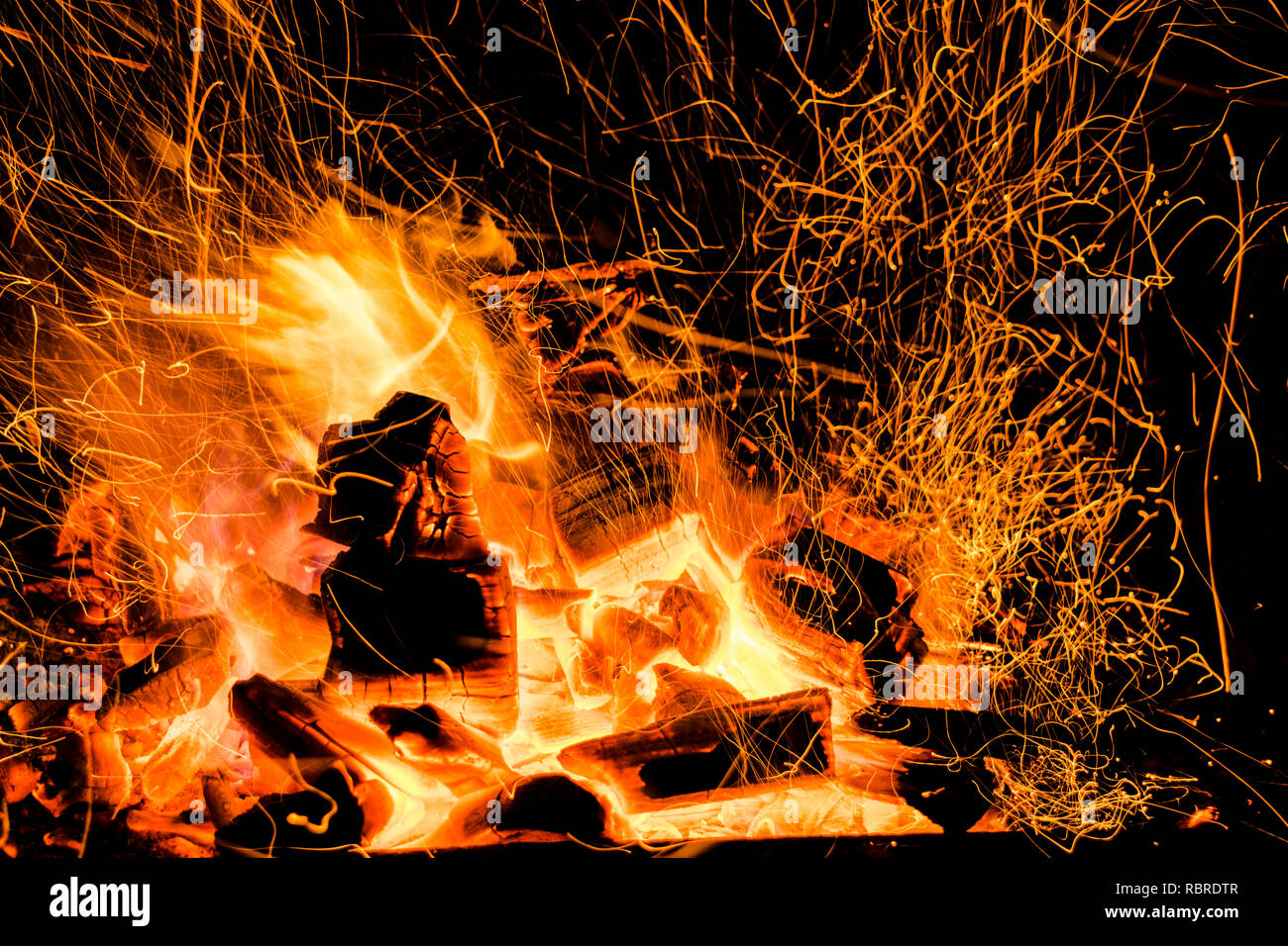 Burning firewood in the fireplace close up, BBQ fire, charcoal