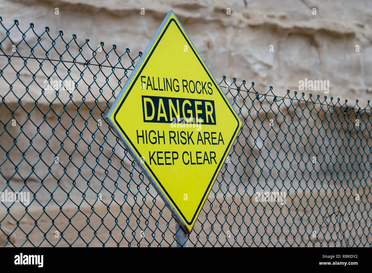 Falling Rocks, Danger, High Risk Area, Keep Clear, warning sign on a