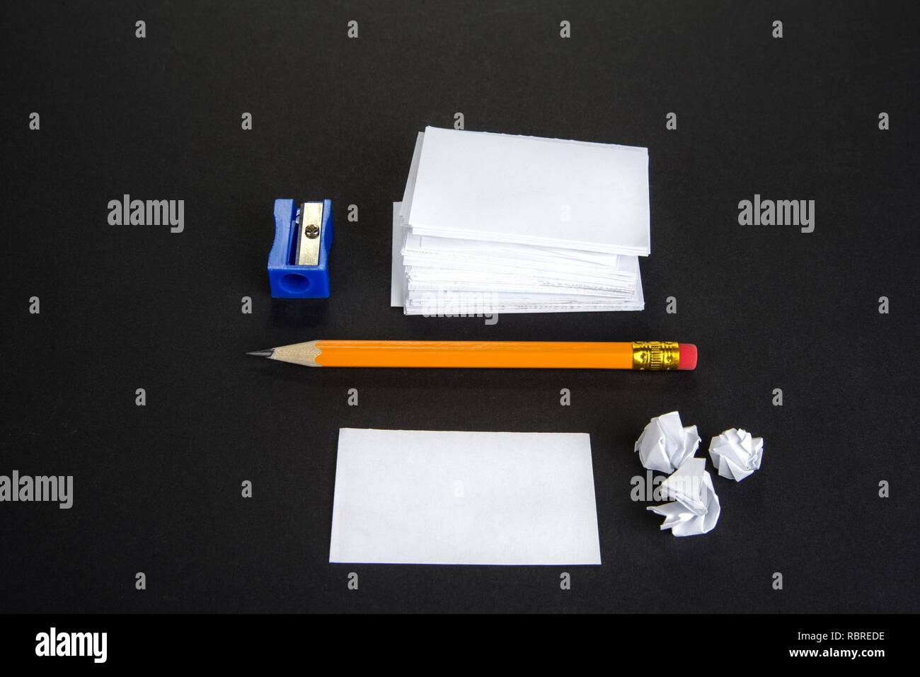 Stack of white paper notes with pencil Stock Photo - Alamy
