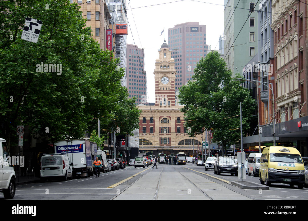 Elizabeth Street, a broad street in Melbourne is cut by the nationally vital Flinders Street railway station Stock Photo