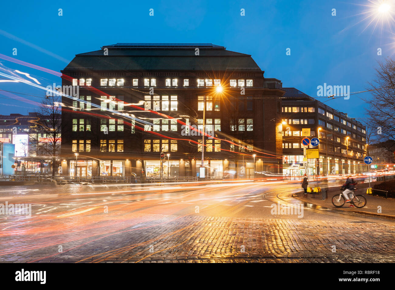 Helsinki, Finland. Building On The Corner Of Arkadiankatu Street And Mannerheimintie Or Mannerheim Avenue In Evening Night Illumination. Stock Photo