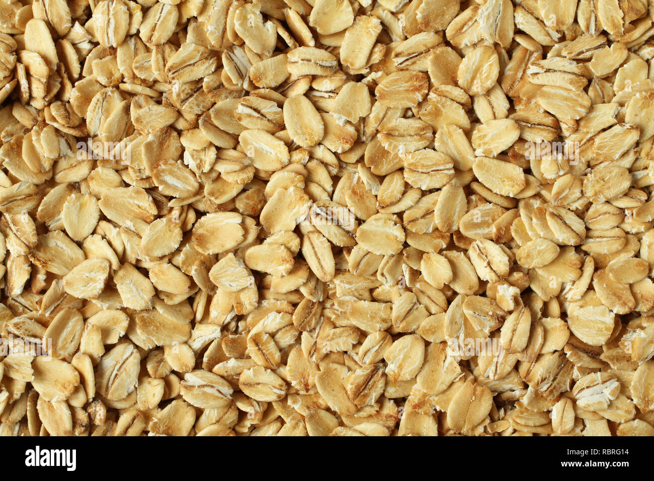 Food background - oat-flakes situated arbitrarily Stock Photo