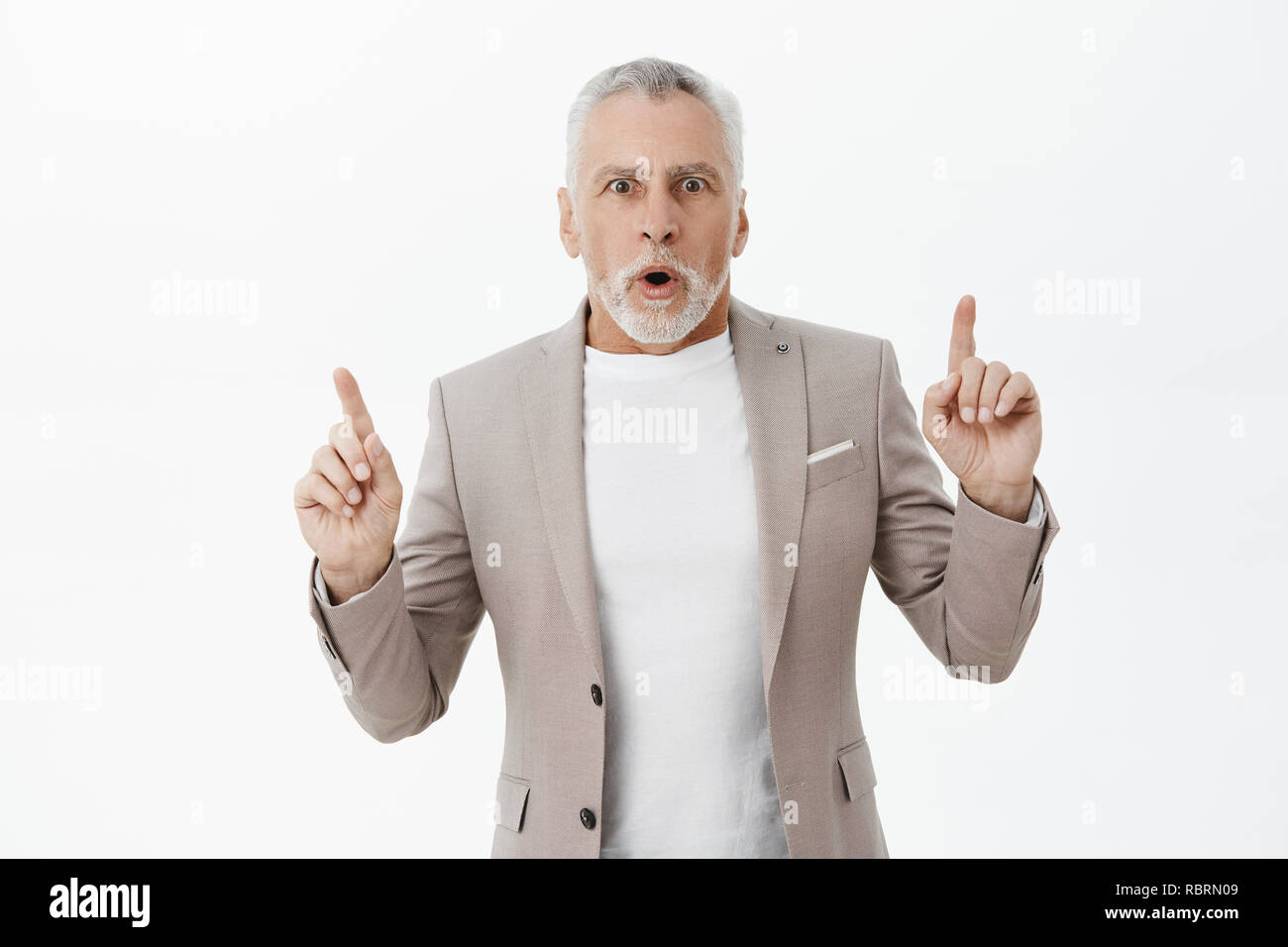 Old man pointing mouth hi-res stock photography and images - Alamy