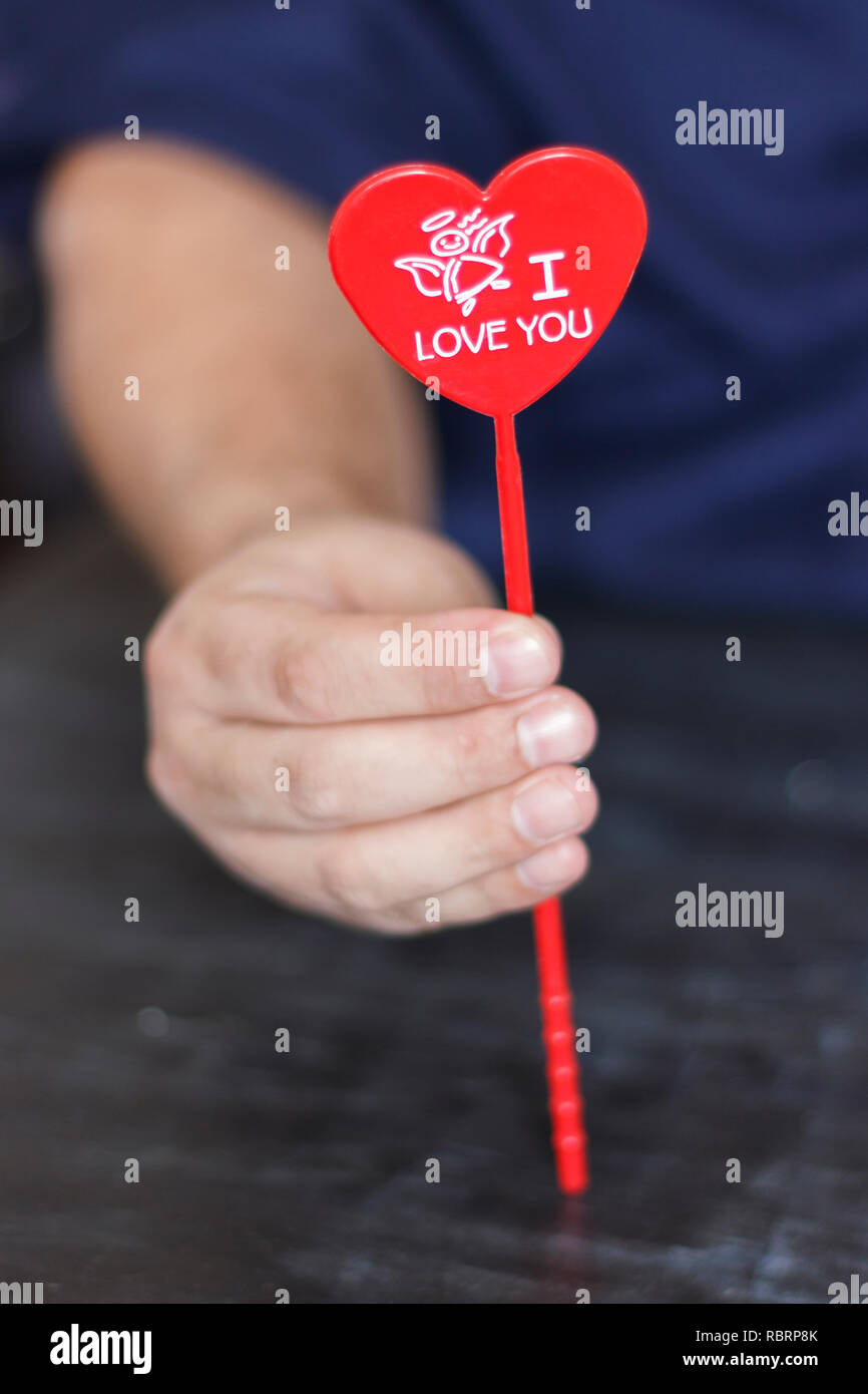 Man holds red heart with the words I love you in his hands Stock Photo ...