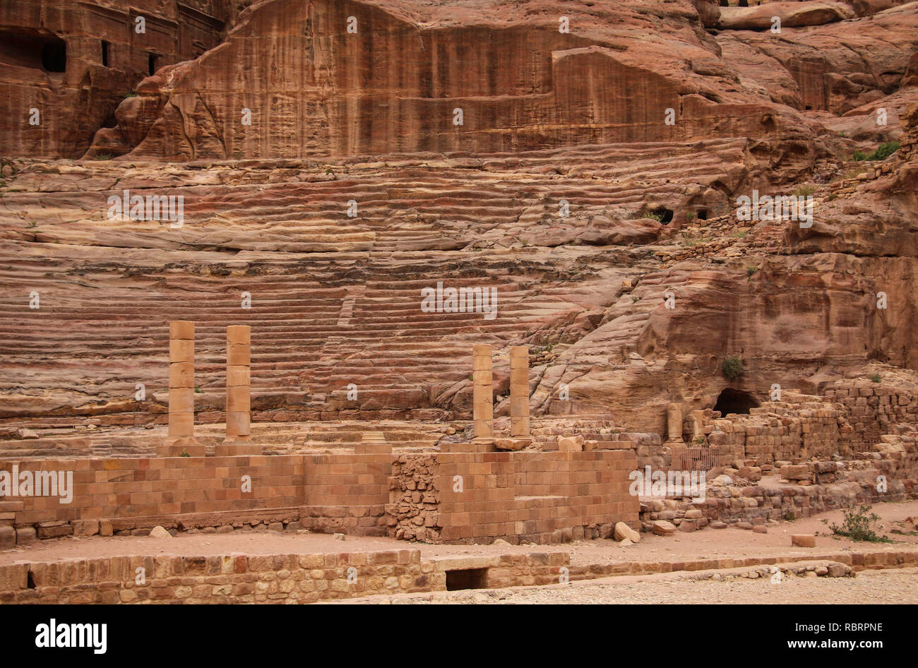 Roman theater in the ancient Arab Nabataean Kingdom city of Petra. Jordan Stock Photo