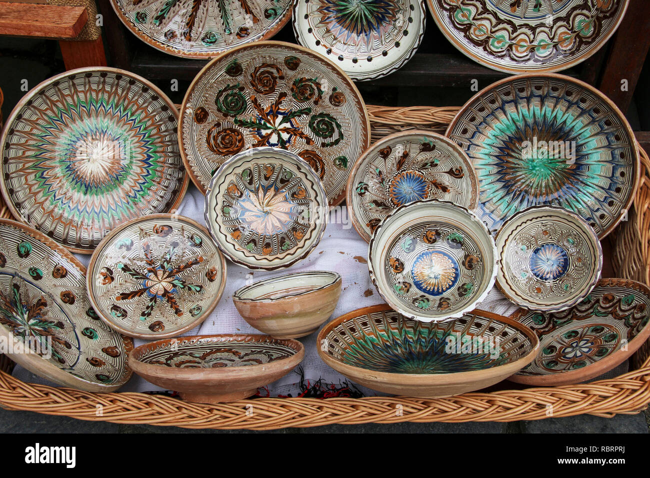 Traditional painted ceramic dishes for sale on one of the markets in  Sighisoara, Romania Stock Photo - Alamy