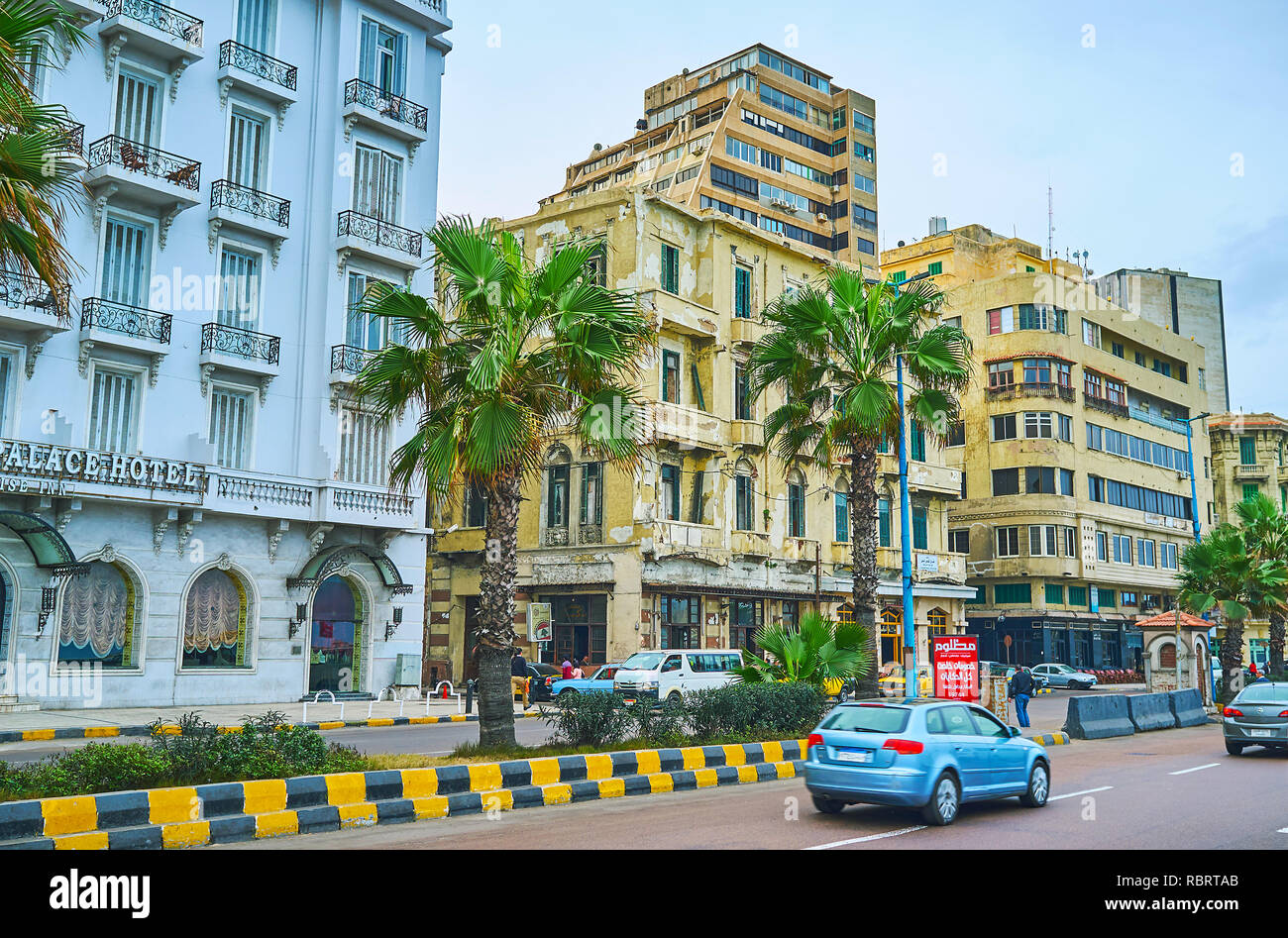 ALEXANDRIA, EGYPT - DECEMBER 19, 2017: The line of historic edifices along the Corniche Avenue, serving as hotels, stores, restaurants, living or admi Stock Photo