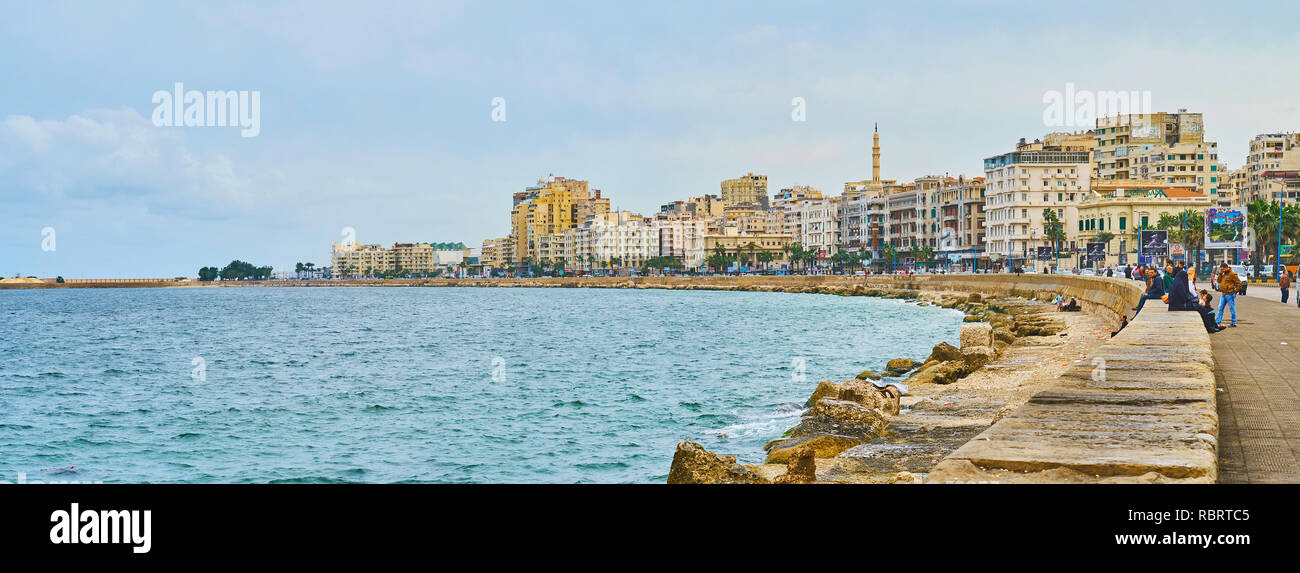 ALEXANDRIA, EGYPT - DECEMBER 19, 2017: The line of buildings along the Corniche Avenue on a grey cloudy morning, on December 19 in Alexandria. Stock Photo