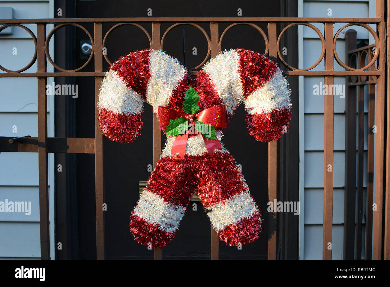 Candy Cane Christmas Decoration On Front Gate Of Townhouse Stock