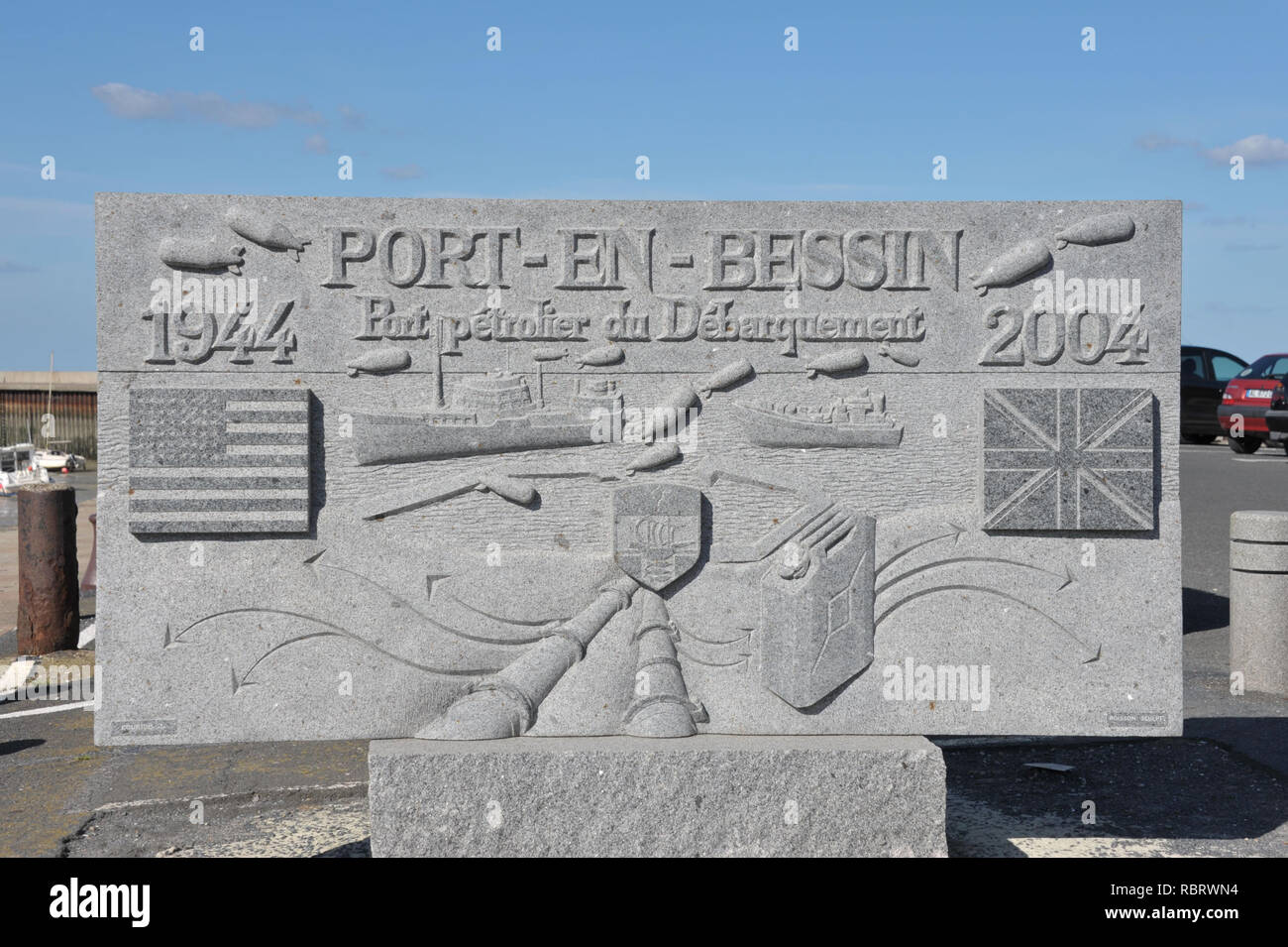 Commemorative stone illustrating the World War Two operations in Port-en-Bessin-Huppain, Normandy, France Stock Photo